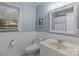 Cozy bathroom featuring wainscoting and a classic design at 16421 Breckshire Dr, Huntersville, NC 28078