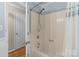Bright bathroom with a shower and neutral-colored walls at 16421 Breckshire Dr, Huntersville, NC 28078