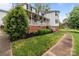 Charming two-story home with a large front porch and landscaped yard at 16421 Breckshire Dr, Huntersville, NC 28078