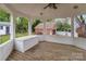 View of the backyard gazebo featuring wood floors and a storage bench at 16421 Breckshire Dr, Huntersville, NC 28078