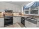Traditional kitchen with stainless steel appliances, granite counters, and white cabinets at 16421 Breckshire Dr, Huntersville, NC 28078