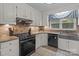 Traditional kitchen with stainless steel appliances, granite counters, and tile backsplash at 16421 Breckshire Dr, Huntersville, NC 28078