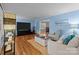 Bright and inviting living room with hardwood floors and ample seating at 16421 Breckshire Dr, Huntersville, NC 28078