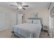Comfortable main bedroom with a ceiling fan, closet, and natural light at 16421 Breckshire Dr, Huntersville, NC 28078