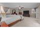 Spacious main bedroom featuring a ceiling fan, natural light, and plush neutral carpeting at 16421 Breckshire Dr, Huntersville, NC 28078