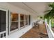 View of a cozy outdoor porch with wooden floors and a view of the neighborhood at 16421 Breckshire Dr, Huntersville, NC 28078