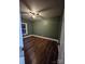 This spacious bedroom features wood-look flooring, neutral walls and a ceiling fan at 1703 Polk St, Monroe, NC 28110