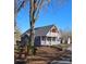 Beautiful home exterior with a large front yard and 'For Sale' sign, ideal for those seeking comfort and style at 1703 Polk St, Monroe, NC 28110