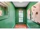 Green entryway with a glass pane door and tiled flooring at 1717 Thomas Ave, Charlotte, NC 28205