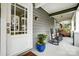 Close up of a front porch with rocking chairs, a hanging porch swing, and an inviting entrance at 1717 Thomas Ave, Charlotte, NC 28205