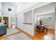 Open hallway leading to a dining room, showcasing the home's layout and architectural details at 1717 Thomas Ave, Charlotte, NC 28205