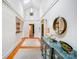 Bright hallway with high ceilings, unique lighting, and decorative elements, leading to other rooms at 1717 Thomas Ave, Charlotte, NC 28205