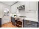 Kitchen featuring stainless steel appliances, white subway tile backsplash, and shaker cabinets at 1717 Thomas Ave, Charlotte, NC 28205