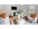 Bright living room featuring a fireplace, hardwood floors, and stylish furnishings at 1717 Thomas Ave, Charlotte, NC 28205