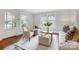 Cozy living room with warm hardwood floors, soft natural light, and neutral-toned decor at 1717 Thomas Ave, Charlotte, NC 28205