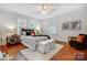 Bedroom with hardwood floors, a ceiling fan, and plenty of natural light from two windows at 1717 Thomas Ave, Charlotte, NC 28205