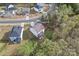 Aerial view of home with fenced backyard, screened porch, deck and mature trees at 18518 Lahaina Ln, Charlotte, NC 28278
