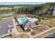 Community pool featuring mature trees and playground at 18518 Lahaina Ln, Charlotte, NC 28278