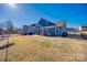 View of fenced backyard featuring a lawn, patio, and screened porch, perfect for outdoor living at 1986 Thoreau Way, York, SC 29745