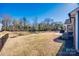 View of a spacious, fenced backyard with a patio area, ideal for relaxing and entertaining guests at 1986 Thoreau Way, York, SC 29745