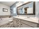 Modern bathroom featuring a double vanity, large framed mirror, bathtub and decorative tile floor at 1986 Thoreau Way, York, SC 29745