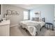 Cozy bedroom featuring a large bed, neutral decor, and natural light from a window at 1986 Thoreau Way, York, SC 29745