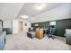 Bonus room featuring a comfortable couch, desk, and modern gaming chair at 1986 Thoreau Way, York, SC 29745