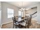 Dining room featuring a large wooden table with seating for six, and pendant lighting at 1986 Thoreau Way, York, SC 29745