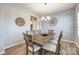 Dining room with a rustic wooden table, stylish chairs, and decorative wallpaper at 1986 Thoreau Way, York, SC 29745