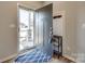 Welcoming entryway with a stylish rug, coat hooks and view of the neighborhood at 1986 Thoreau Way, York, SC 29745