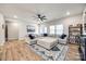 Spacious living room with a large sectional sofa, decorative rug, and natural light at 1986 Thoreau Way, York, SC 29745