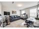 Bright, carpeted home office with a sofa, desk, exercise equipment, and natural light at 1986 Thoreau Way, York, SC 29745