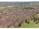 An aerial view of expansive wooded acreage near a large commercial building at 2018 Fox Creek Trl, Lincolnton, NC 28092