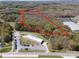 Aerial view of wooded property with approximate property lines overlaid in red at 2018 Fox Creek Trl, Lincolnton, NC 28092