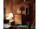 Cozy bedroom with wood paneling, and a classic dresser, perfect for a relaxing retreat at 2018 Fox Creek Trl, Lincolnton, NC 28092