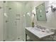Elegant bathroom with a tiled shower, glass door, and marble countertop at 2021 Nolen Park Ln, Charlotte, NC 28209