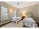 Inviting bedroom with two twin beds, soft lighting, and neutral decor at 2021 Nolen Park Ln, Charlotte, NC 28209