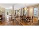 Elegant dining room with hardwood floors, area rug, and stylish chandelier at 2021 Nolen Park Ln, Charlotte, NC 28209