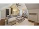 Comfortable living room featuring a plush sofa, hardwood floors, and a built-in desk at 2021 Nolen Park Ln, Charlotte, NC 28209