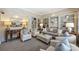 Sitting room boasts built-in bookshelves, recessed lighting, and comfortable seating arrangements at 2021 Nolen Park Ln, Charlotte, NC 28209