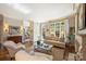 Bright living room featuring hardwood floors, fireplace, and natural light from multiple windows at 2021 Nolen Park Ln, Charlotte, NC 28209