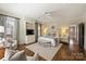 Spacious primary bedroom features hardwood flooring, recessed lighting, and a ceiling fan at 2021 Nolen Park Ln, Charlotte, NC 28209