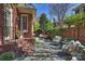 Charming patio with stone flooring, brick accents, and cozy outdoor seating at 2021 Nolen Park Ln, Charlotte, NC 28209