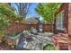 Charming brick patio with stone flooring and outdoor seating, perfect for relaxing and entertaining at 2021 Nolen Park Ln, Charlotte, NC 28209