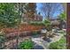 Picturesque patio area with comfortable seating, brick walls, and mature trees providing ample shade at 2021 Nolen Park Ln, Charlotte, NC 28209