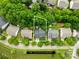 An aerial view of the property showcasing its location surrounded by lush greenery and neighboring houses in a suburban setting at 20827 Brinkley St, Cornelius, NC 28031