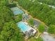 Aerial view of neighborhood amenities, including a pool and tennis courts at 20827 Brinkley St, Cornelius, NC 28031