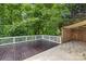 Back of house showing the deck with built-in hot tub and artificial turf area at 20827 Brinkley St, Cornelius, NC 28031