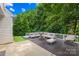 An amazing backyard deck with furniture set, fire pit, egg chair, a patch of artificial turf, and a small pool at 20827 Brinkley St, Cornelius, NC 28031