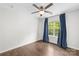 Bright bedroom featuring hardwood floors, a window, and neutral walls at 20827 Brinkley St, Cornelius, NC 28031
